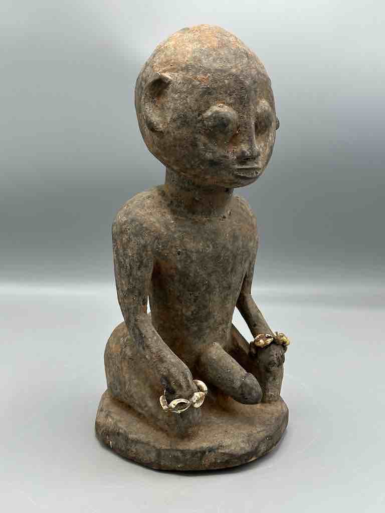 Short kneeling Yoruba male fetish figure - Benin