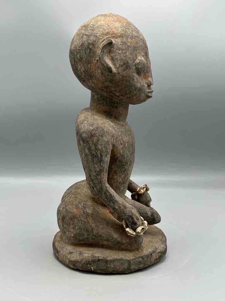 Short kneeling Yoruba male fetish figure - Benin