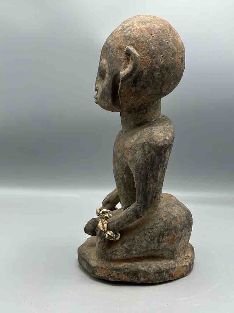 Short kneeling Yoruba male fetish figure - Benin