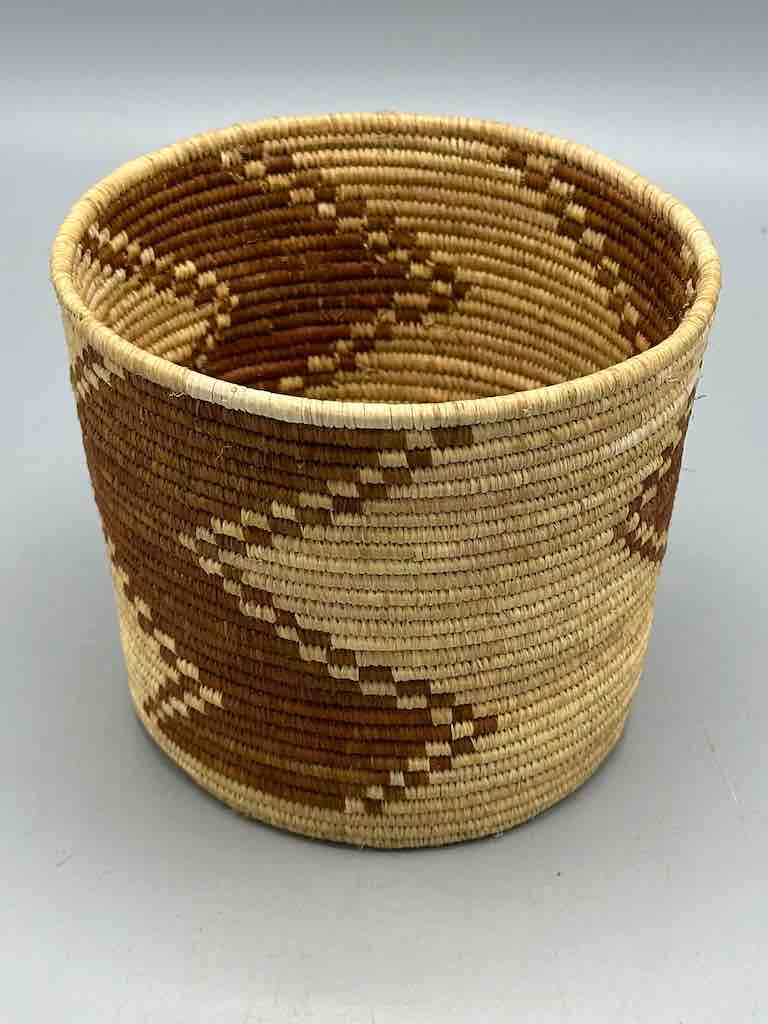 Brown zigzag cylinder tightest weave Batwa basket