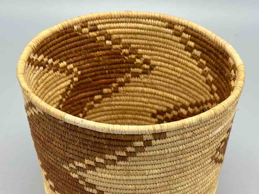 Brown zigzag cylinder tightest weave Batwa basket