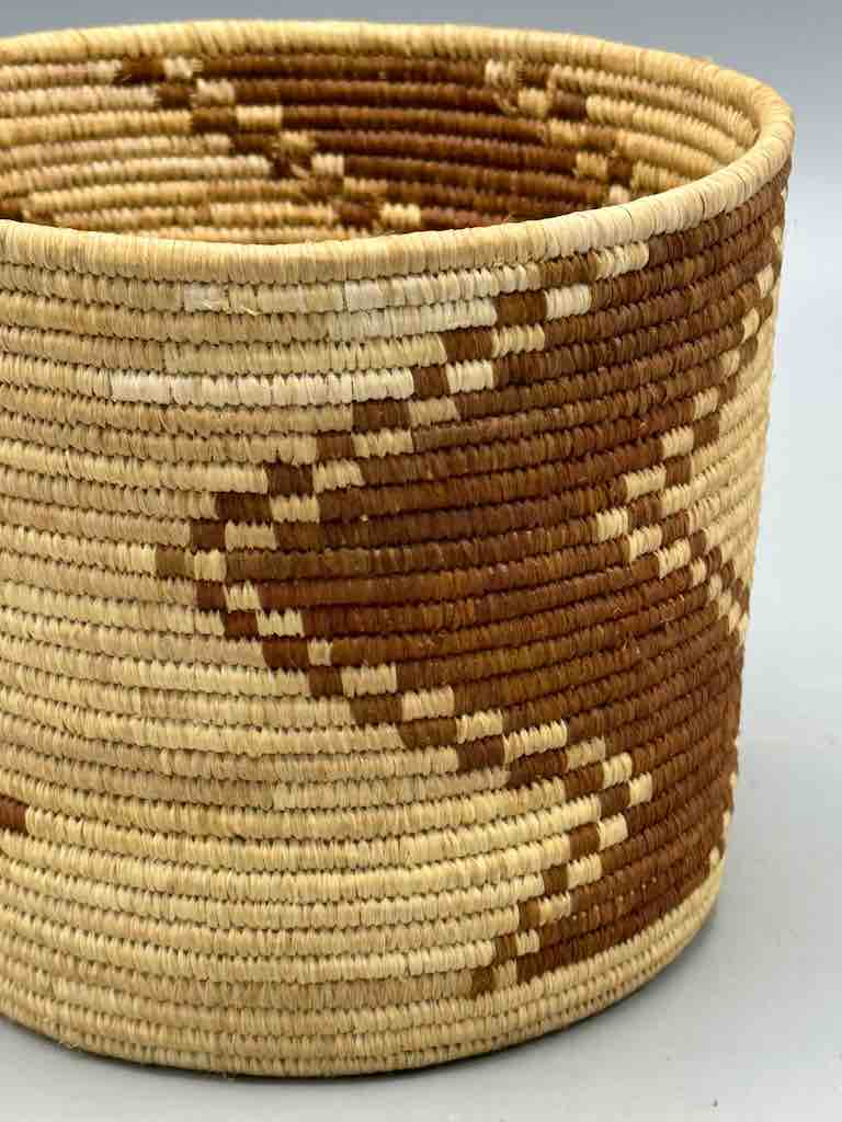 Brown zigzag cylinder tightest weave Batwa basket