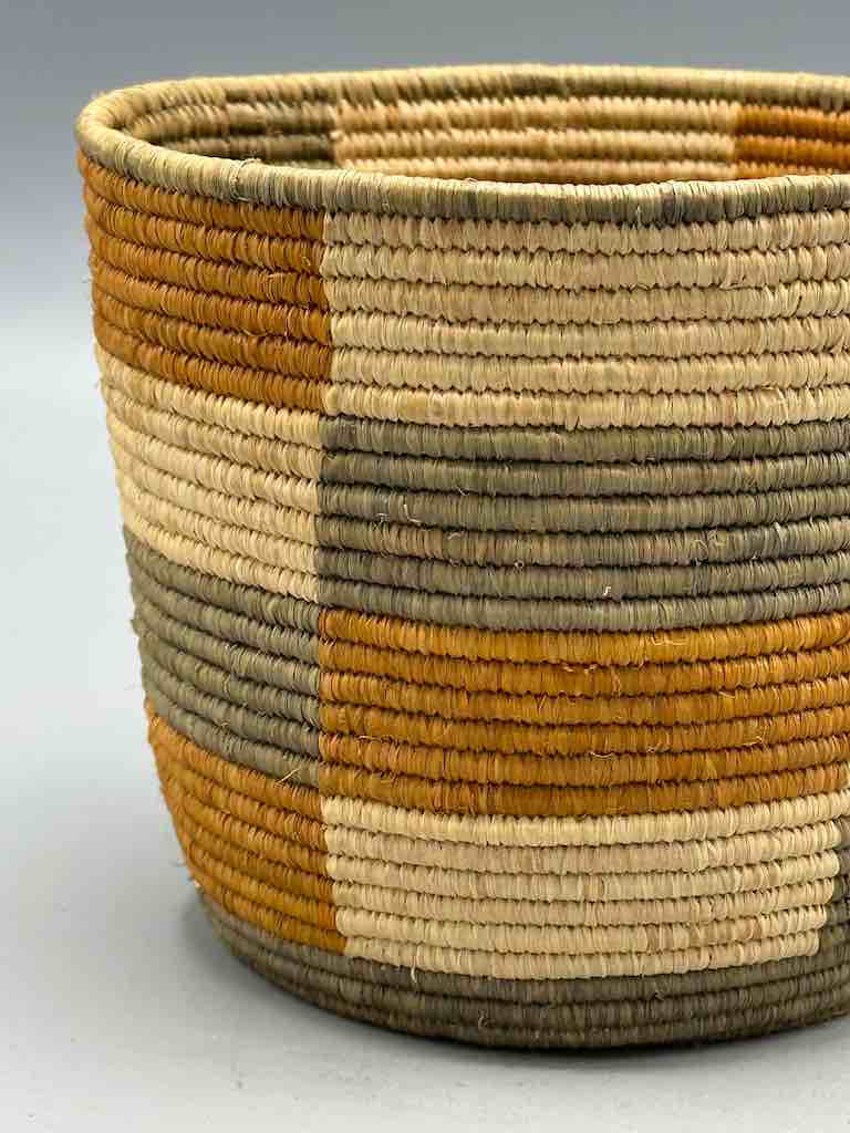Earth tone checkerboard cylinder tightest weave Batwa basket