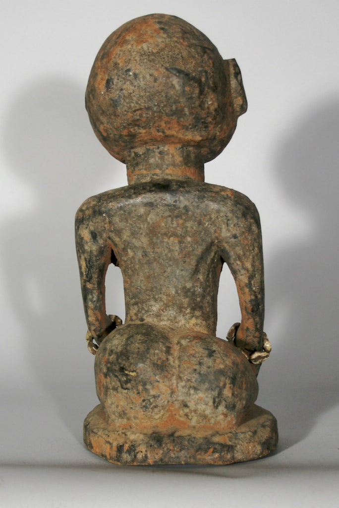 Short kneeling Yoruba male fetish figure - Benin