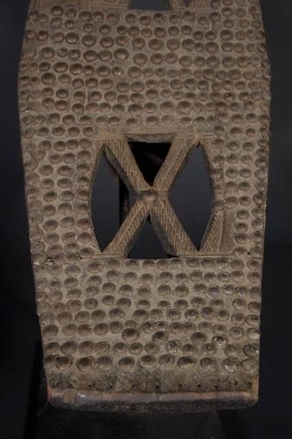 Old Ngombe back rest decorated with metal tacks