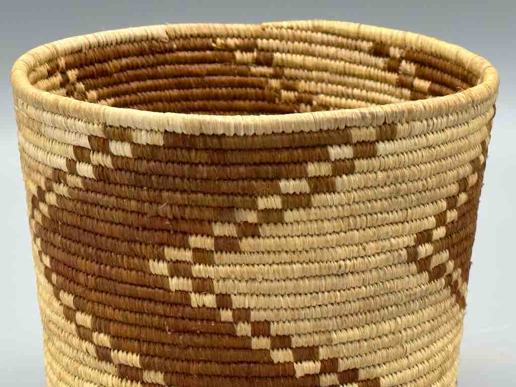 Brown zigzag cylinder tightest weave Batwa basket