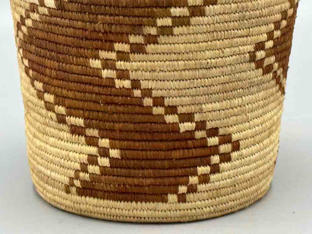 Brown zigzag cylinder tightest weave Batwa basket