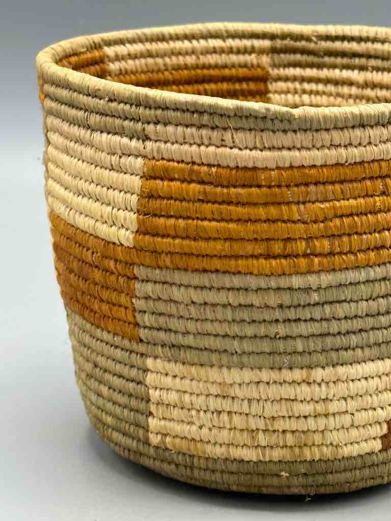 Earth tone checkerboard cylinder tightest weave Batwa basket