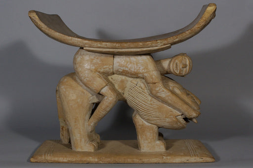 Man on Lion Stool