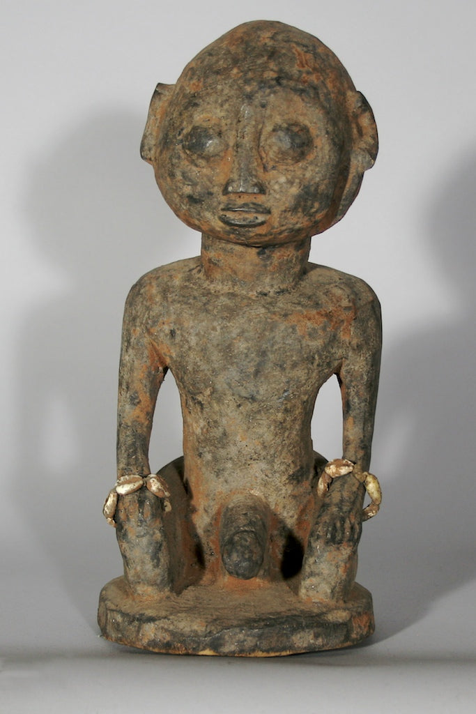 Short kneeling Yoruba male fetish figure - Benin