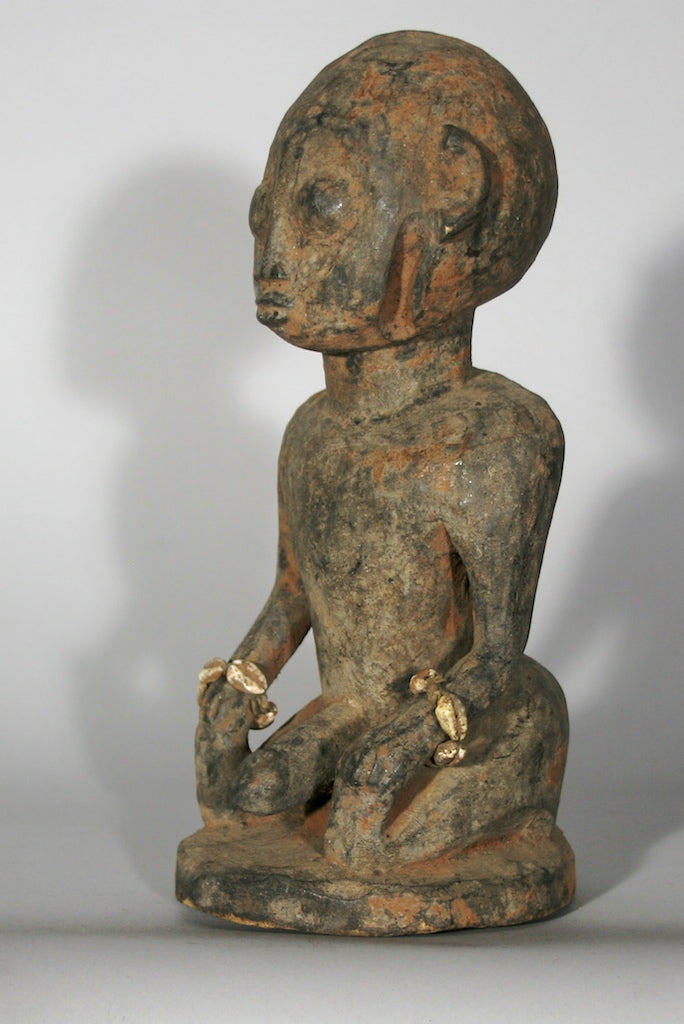 Short kneeling Yoruba male fetish figure - Benin